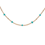 Collier plaqué or boules et résine vert turquoise