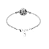 Bracelet acier et cordon blanc motif rond résine et nacre blanche et noire