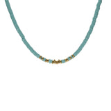 Collier acier rondelles turquoise imitation et boules dorées