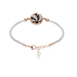 Bracelet acier et pvd rose avec cordon blanc motif rond avec résine blanche et noire